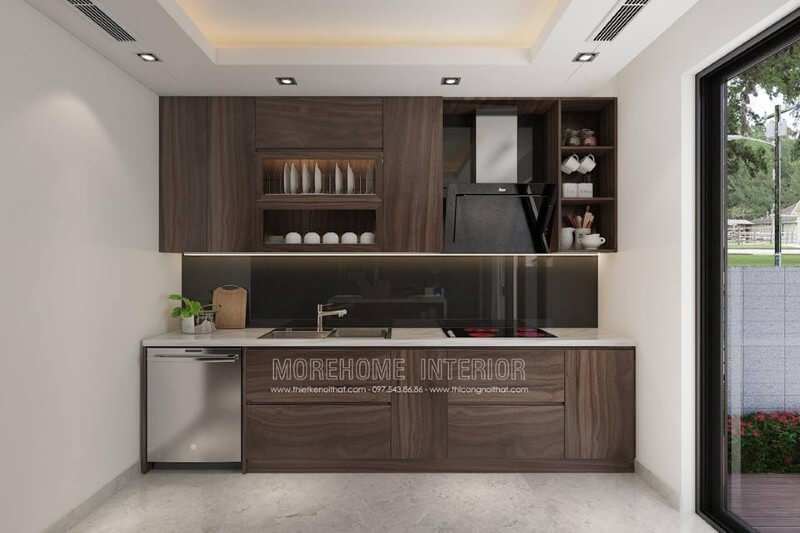 Mẫu tủ bếp với đường vân độc đáo cùng gỗ tối màu đã tạo nên không gian bếp hiện đại sang trọng. Thiết kế tủ bếp biệt thự sang trọng