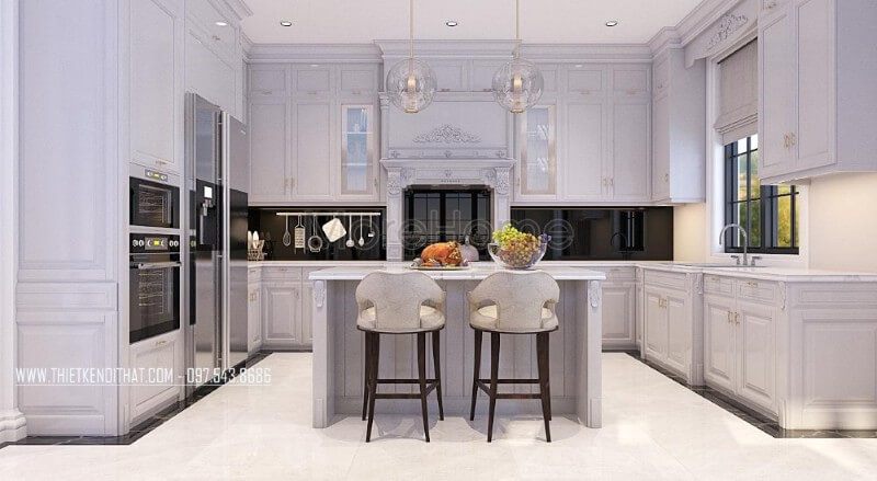 Mẫu tủ bếp biệt thự tân cổ điển được làm từ gỗ tự nhiên phun sơn màu trắng cao cấp, những nét hoa văn cầu kì, tỉ mỉ tạo nên một không gian cuốn hút mà bất kì ai cũng muốn sở hữu